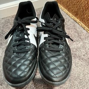 Black and White Nike Indoor Cleats.